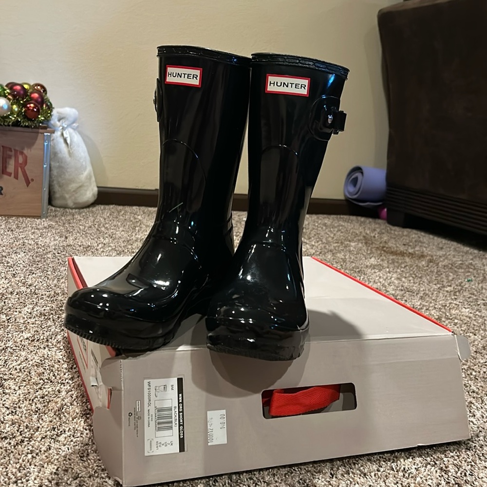 **Brand New**. Hunter high gloss black mid calf boots.  Ordered wrong size.